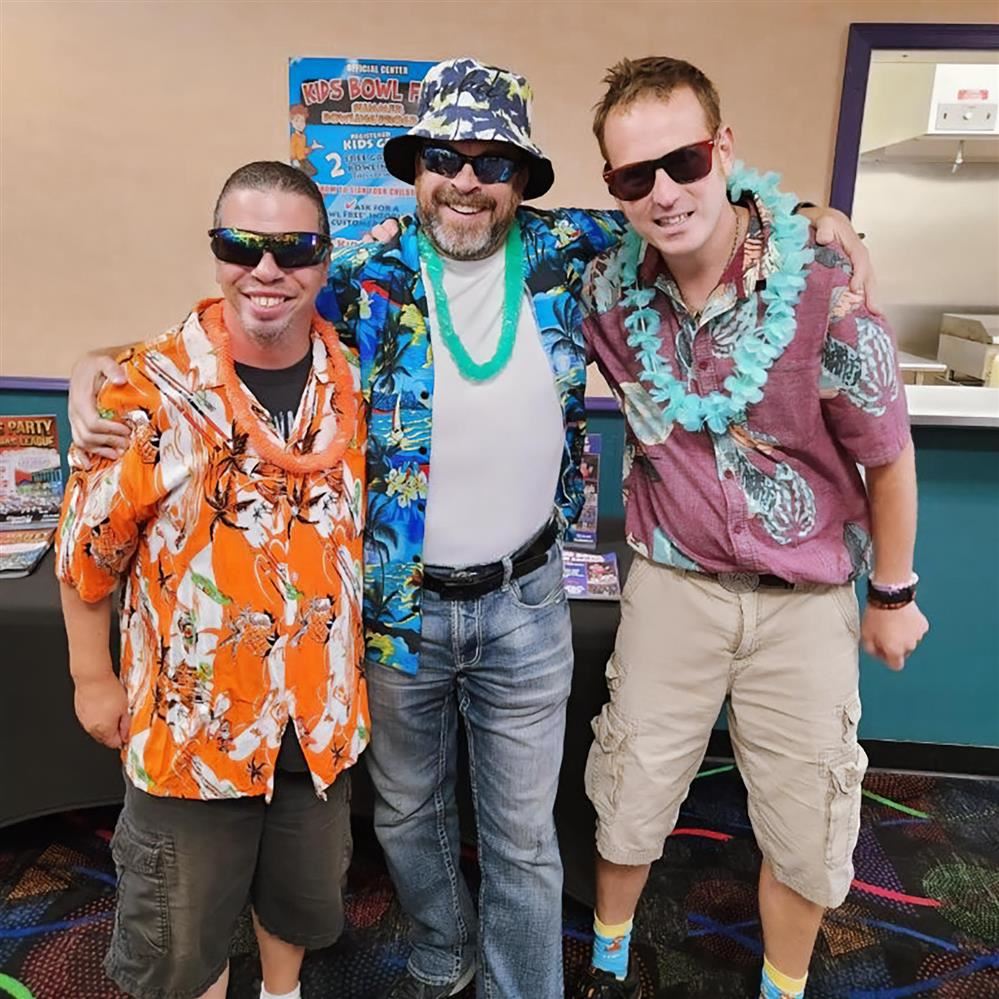  Three men in Hawaiian shirts